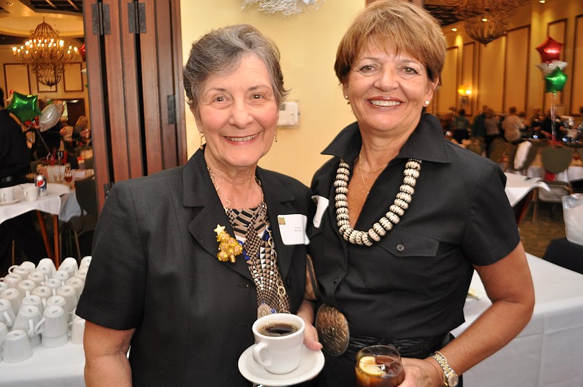 Cheryl Mooney and Arta Burkhart enjoy refreshments.