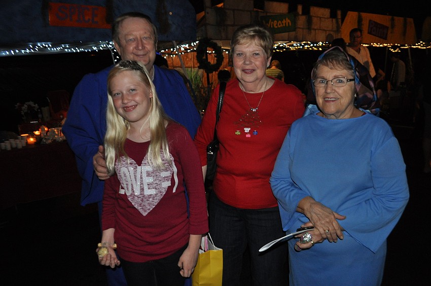 Carson DeLay stands with her grandparents, Randy and Ellen Hanson, and church choir director Barbara Miller.