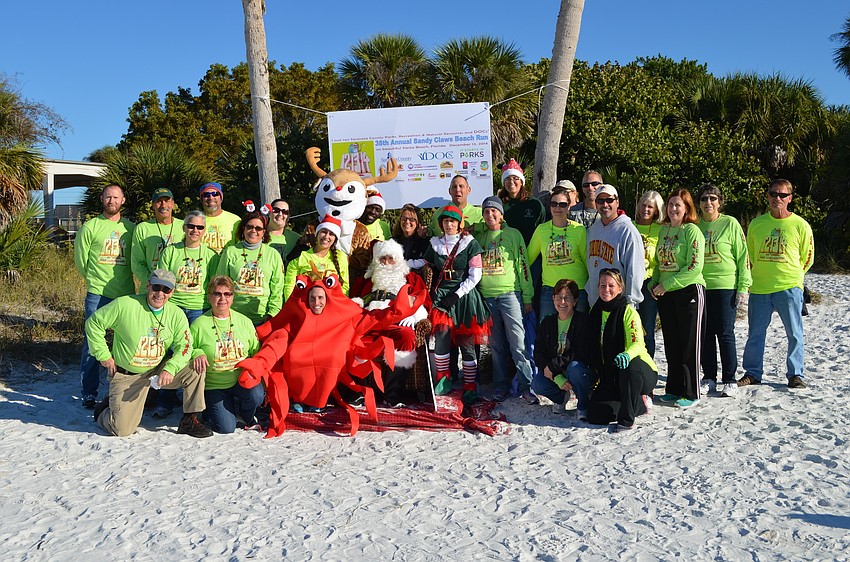 Members of the Sarasota Parks and Recreation pose with Santa Claus.