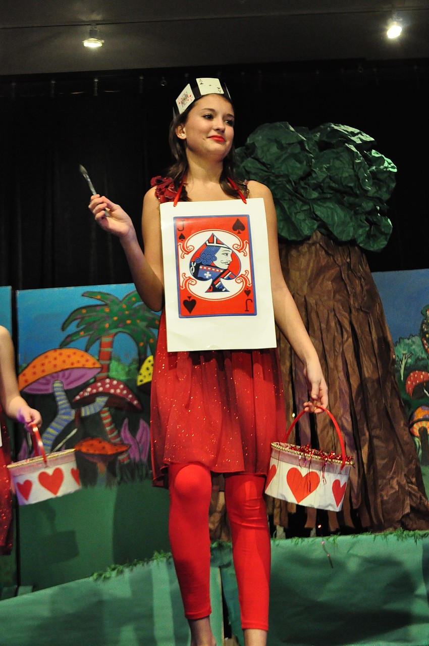 Vanessa Kratounkov paints the roses red.