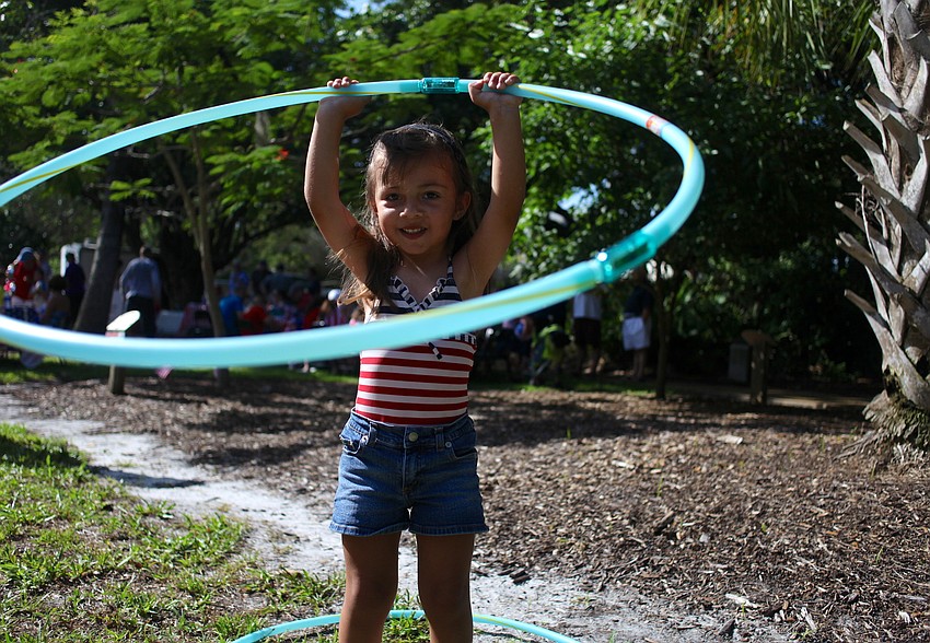 Zuleika Zunz plays with a hula-hoop.