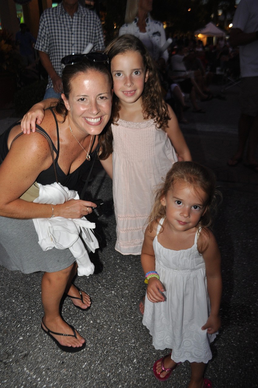 Tammy Blake dances with her daughters, Sara, 7, and Amma, 2.