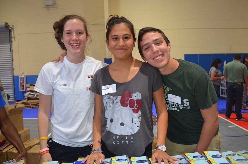 Boys and Girls Club volunteers Maggie Hogan, Maribel Cedillo and Daniel DiDomenico