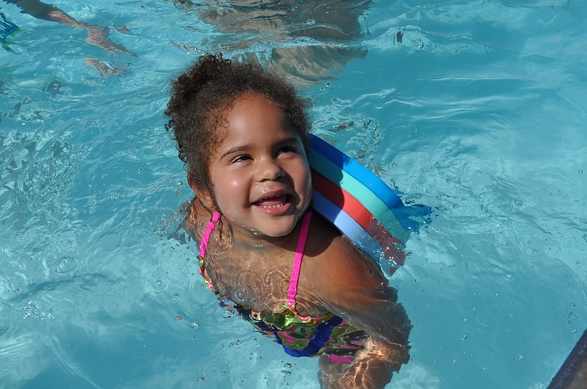Jaelyn Dismuke, 3, waits for her mom, Joanna Carrier, to get in the water.