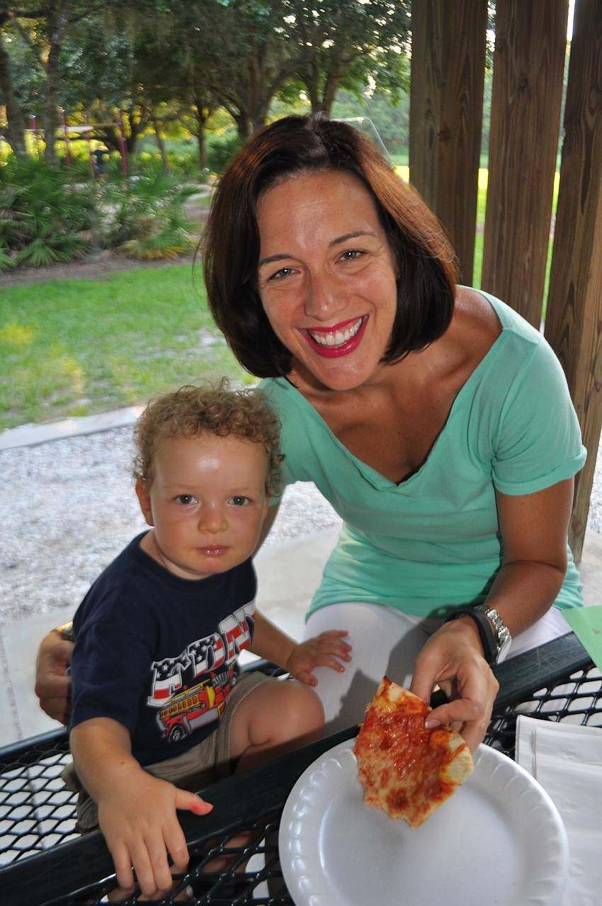 Gabriel Goldstein feasts on pizza with his mom, Ann.