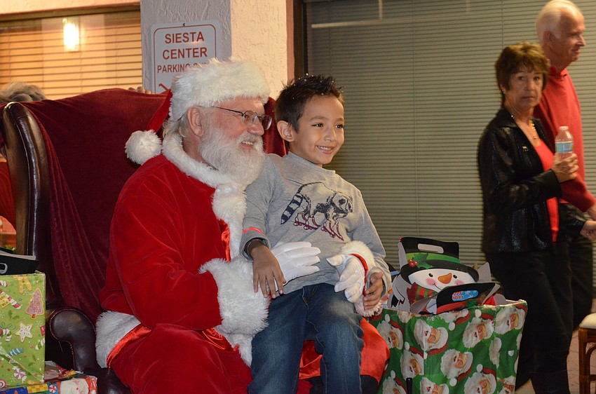Paul Dosal talks with Santa about what he would like for Christmas.