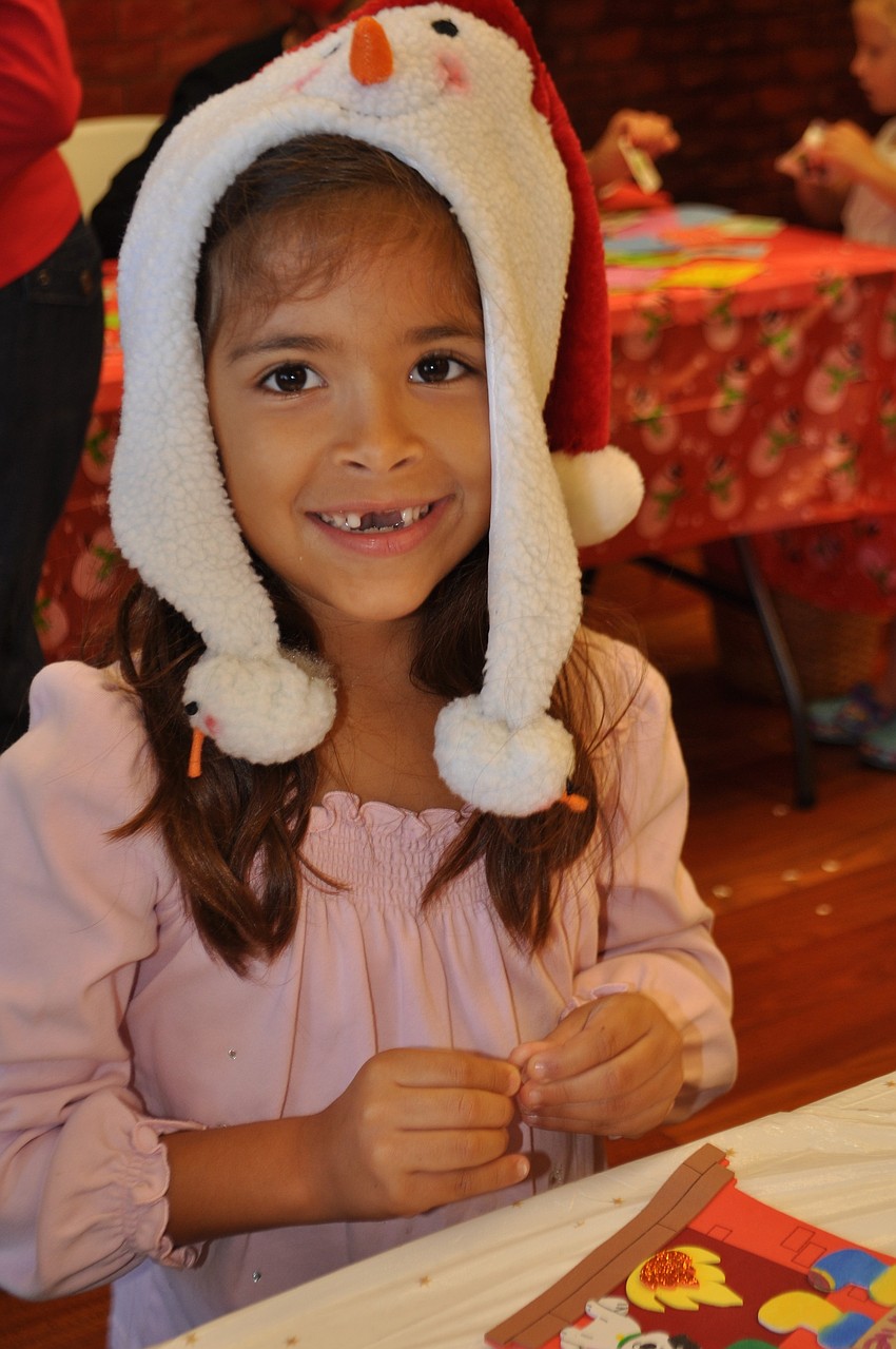 Daniela Landry-Hernandez makes a craft.