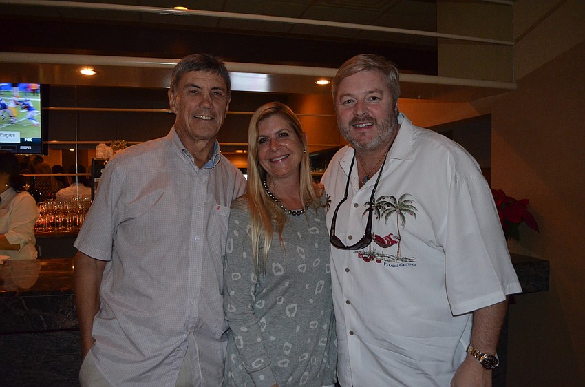 Graham Brooks, of Wyland Galleries, Ann Casadio, of 15 South, and Guy Vincent, of Wyland Galleries