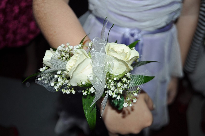 Girls received corsages.