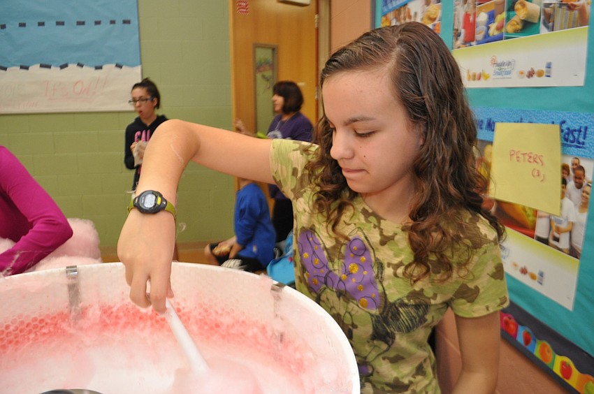 Toni Gulbrandsen makes cotton candy for the crowd.