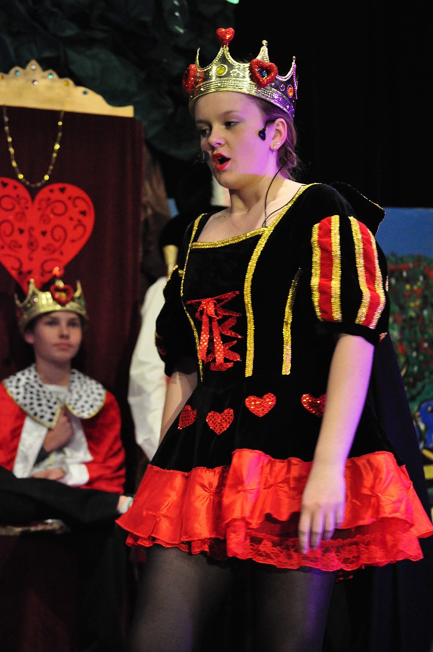 Phoebe Bond-Abraham, as the queen, is eager to cut off Alice's head.