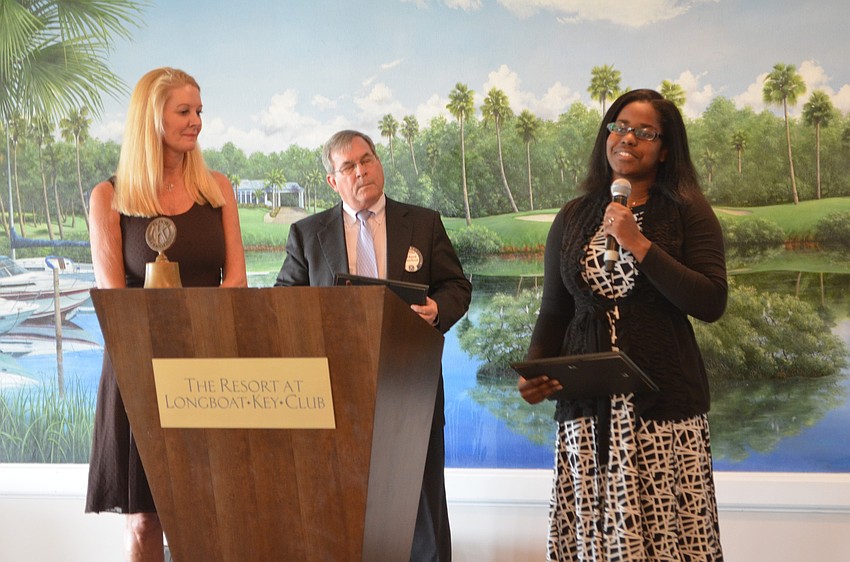 Keisa Saint-Fleur, Pensacola Christin College, is awarded a technical scholarship by Scholarship Committee Chair Susan Philips and Longboat Kiwanis Club President Richard Crawford.