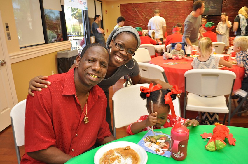 Joseph and Kay Lovett enjoy pancakes with their daughter, Lola.