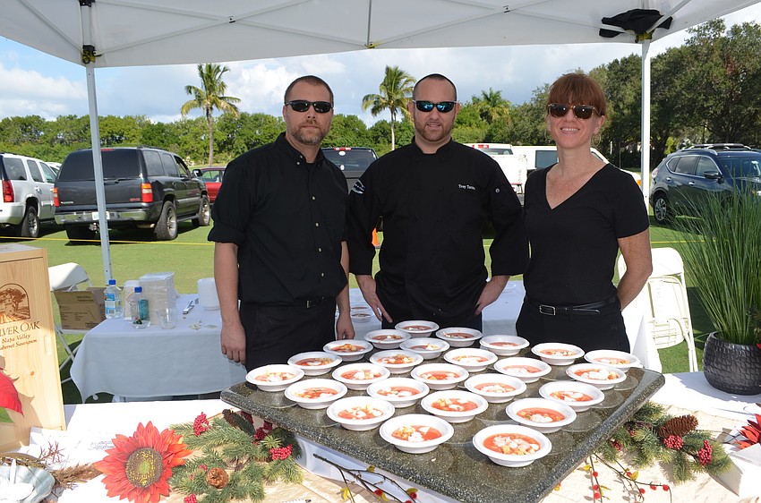 Brandon Peterson, Troy Torman and April Scott, of the Crab & Fin