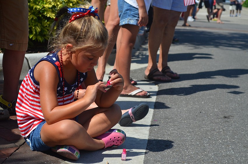 Cali Polidan takes a break from cheering.