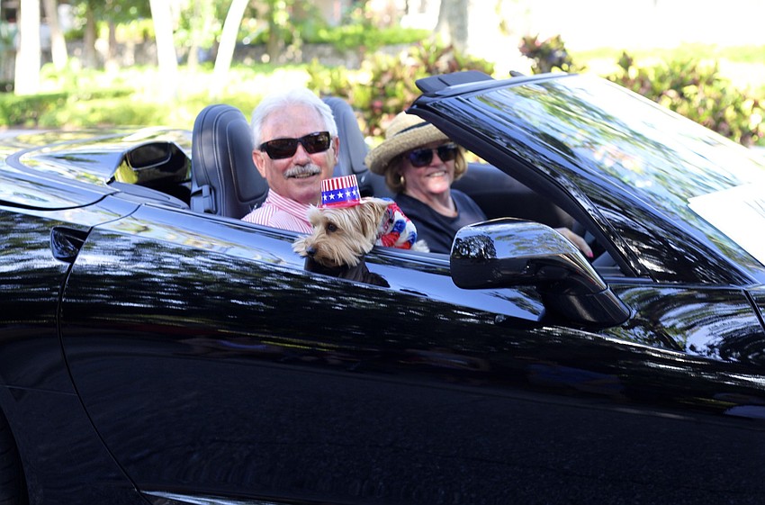 A furry friend joins Mayor Jim Brown during the parade.