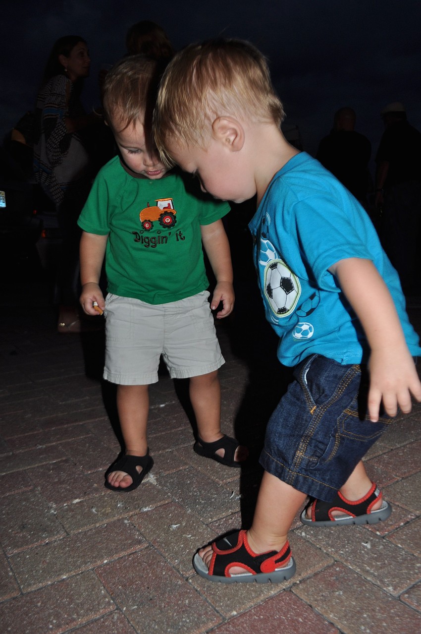 Milena Dini and Anthony Buono listen to music.