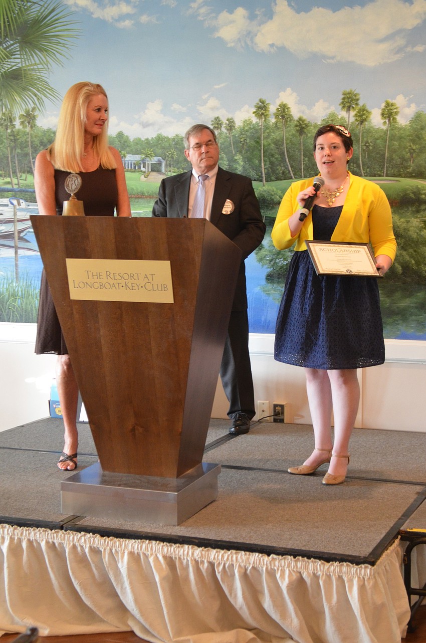 Charles Needham, State College of Florida, is awarded a technical scholarship by Scholarship Committee Chair Susan Philips and Longboat Kiwanis Club President Richard Crawford.
