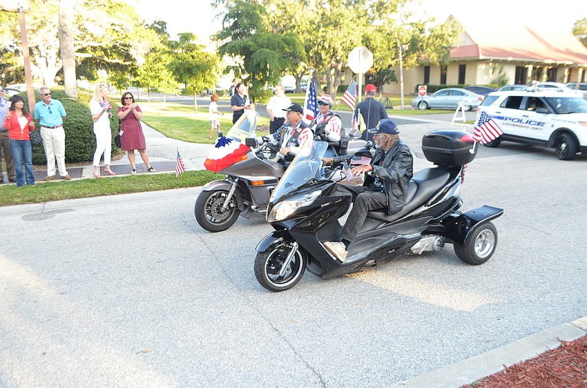 In addition to veterans marching and riding in convertibles, three chose to ride on motorcycles.