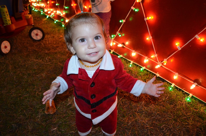 Savannah Galati, 11, months, dresses up like Santa