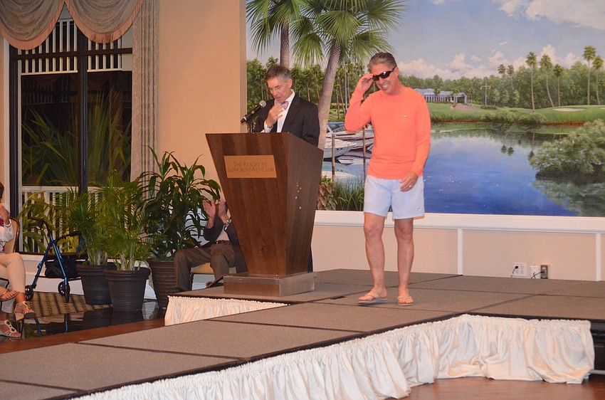 Michael Garey, of the Lazy Lobster, struts down the runway.