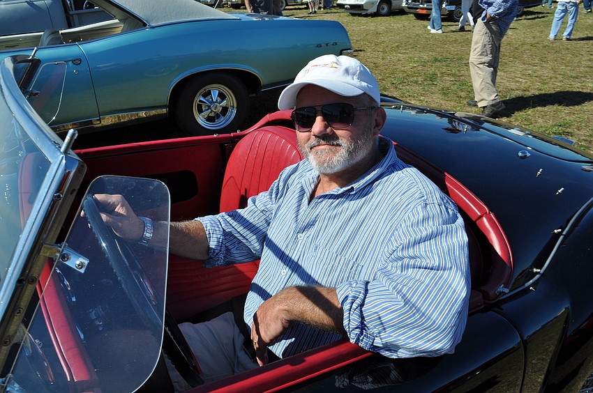 Patrick Kondrat, of Sarasota, drives away in his 1959 MGA.