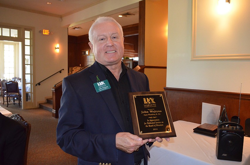 John Wojtyna, of Aqua Plumbing and Air, receives an outgoing board of director award. He also received the Eager Beaver award.