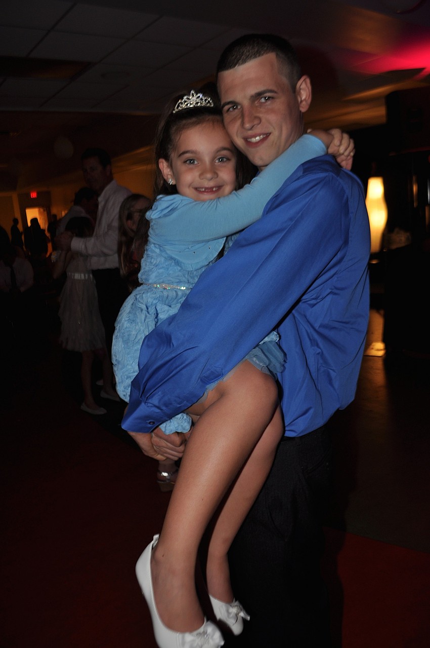 Shellianna Rizzo, 6, feels like a princess in the arms of her dad, Eugenio.