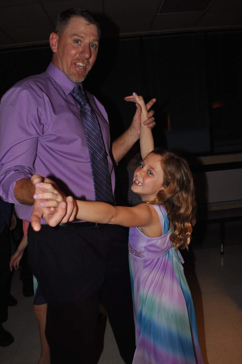 Chris Coleman dances to â€œLet It Goâ€ with his daughter, Kasey.