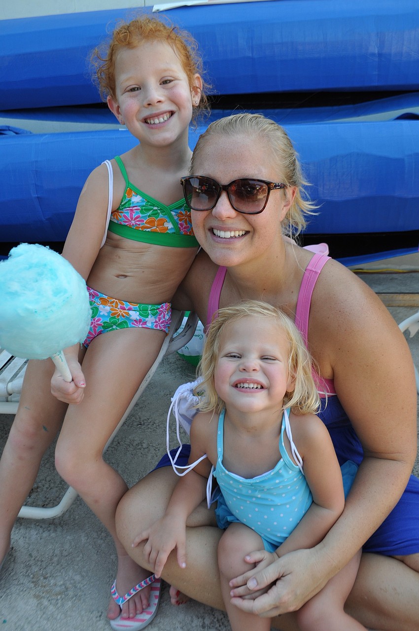 Taylor, Sarah and Kaitlyn Berk hang out in the shade.