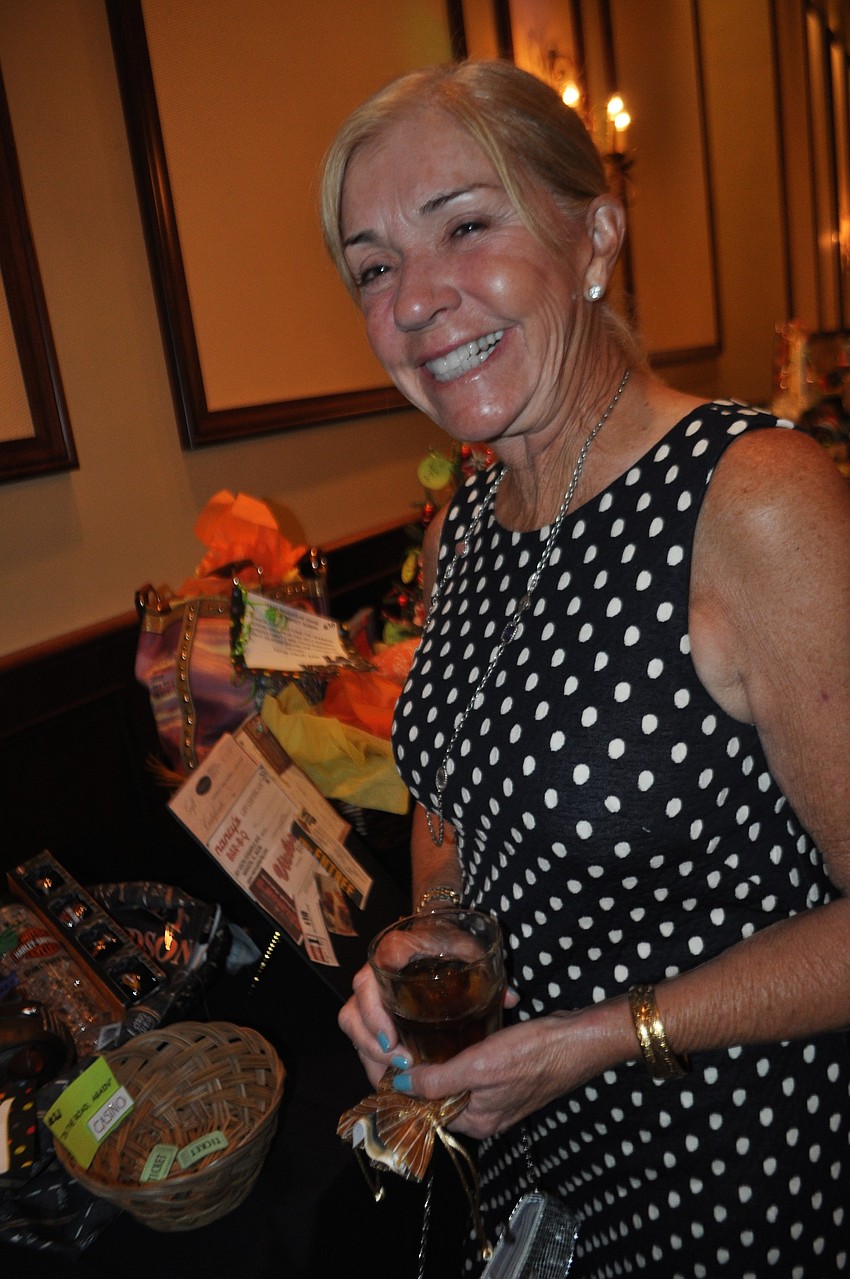 Renee Wilson checks out silent auction items.