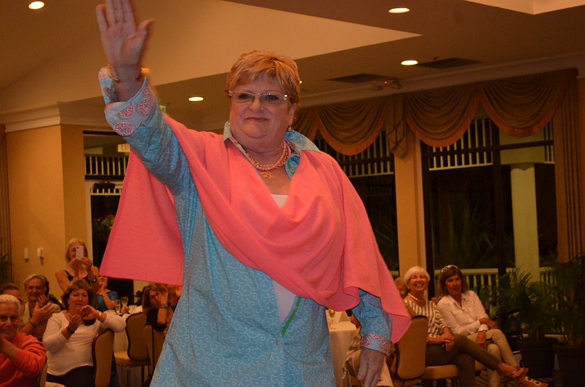 Realtor Maureen Horn waves to her admirers.