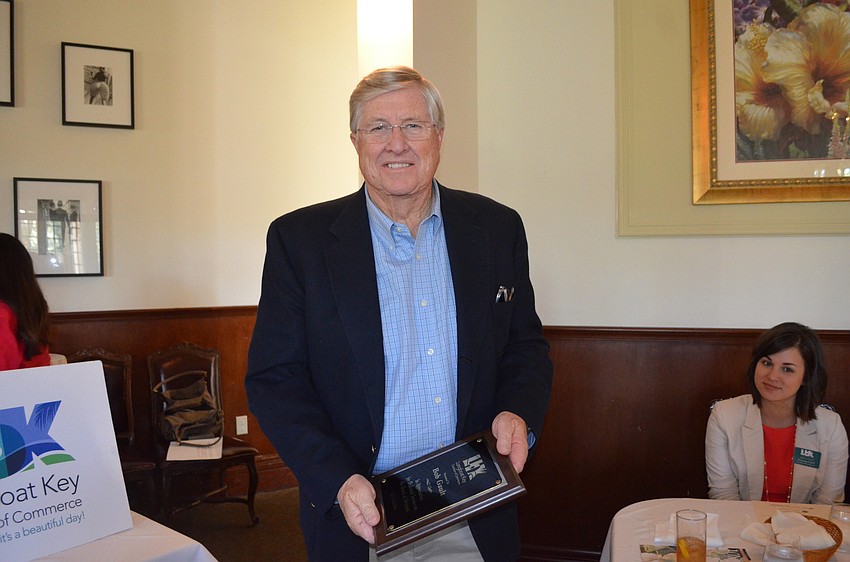 Bob Gault receives an outgoing board of directors award to thank him for his service.
