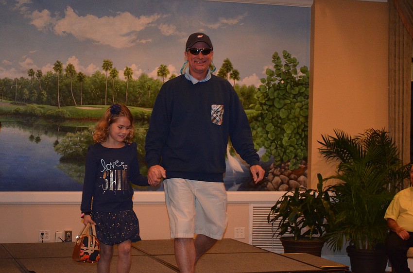 Dan Wade, event manager of the Longboat Key Club, models with daughter Carly.