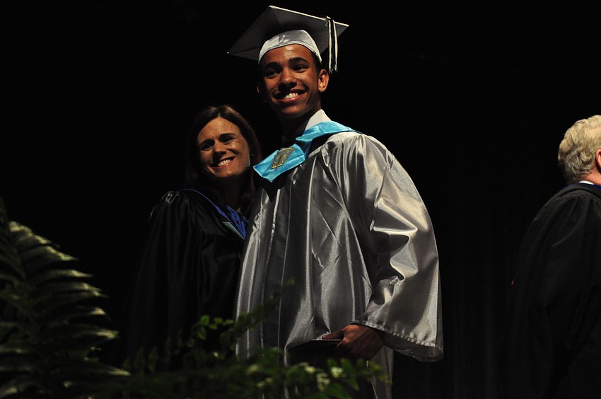 Principal Jenny Gilray congratulates Matthew Griffin