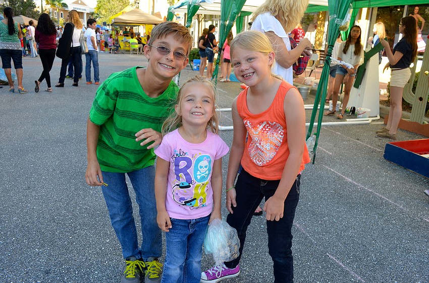 Joshua and Jillian McManis pose with Abigail Burwood.
