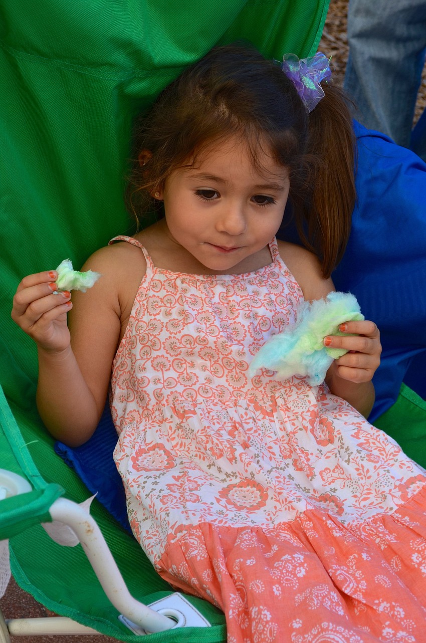 Valentina Suarez snacks on cotton candy.