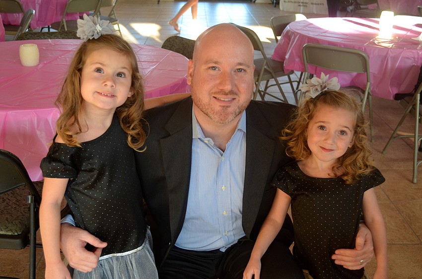 Geoff Springfield stands flanked by his daughters, Courtney and Cristina.