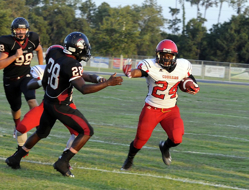 Cardinal Mooney running back Jaz Mongeon attempts to break to the outside in the second half.