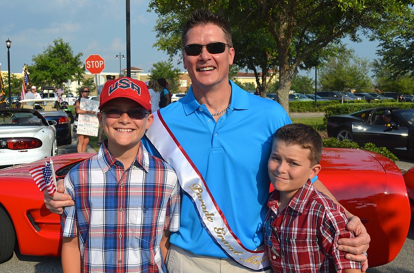Grand marshal John Breiner, flanked by his sons, Jason and Derek.