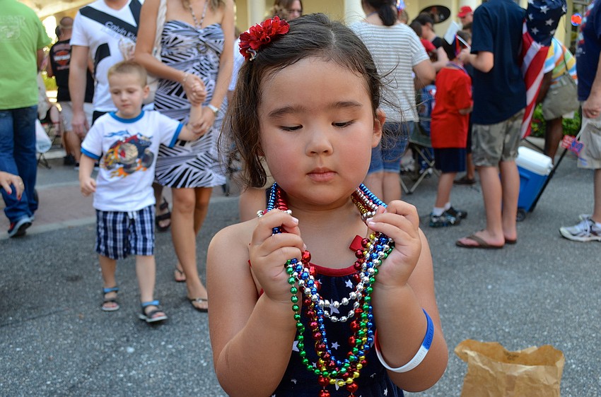 Nia Knipp admires all the beads she collected.