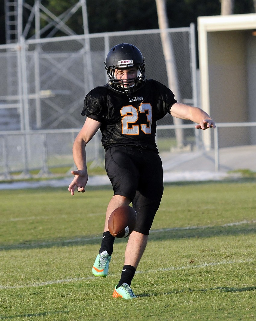 Sarasota junior Billy Sadlo punts the ball in the first half.