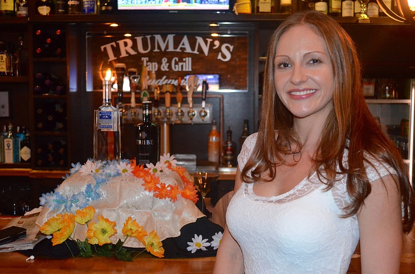 Meghan Keever enjoys drinks while waiting for more members to arrive.