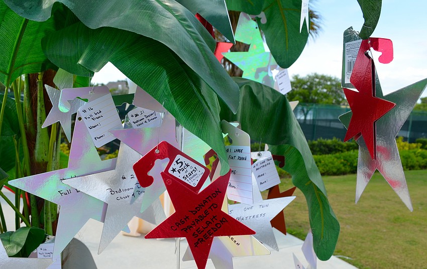 The Selah Freedom Tree of Hope is filled with stars listing items that can be donated.