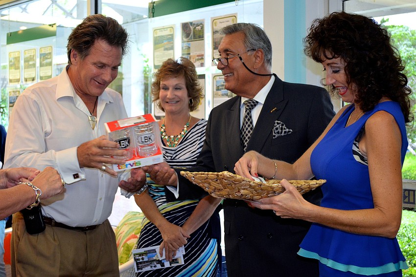 Terry Cunningham receives a Tervis prize after his card was picked in the draw.