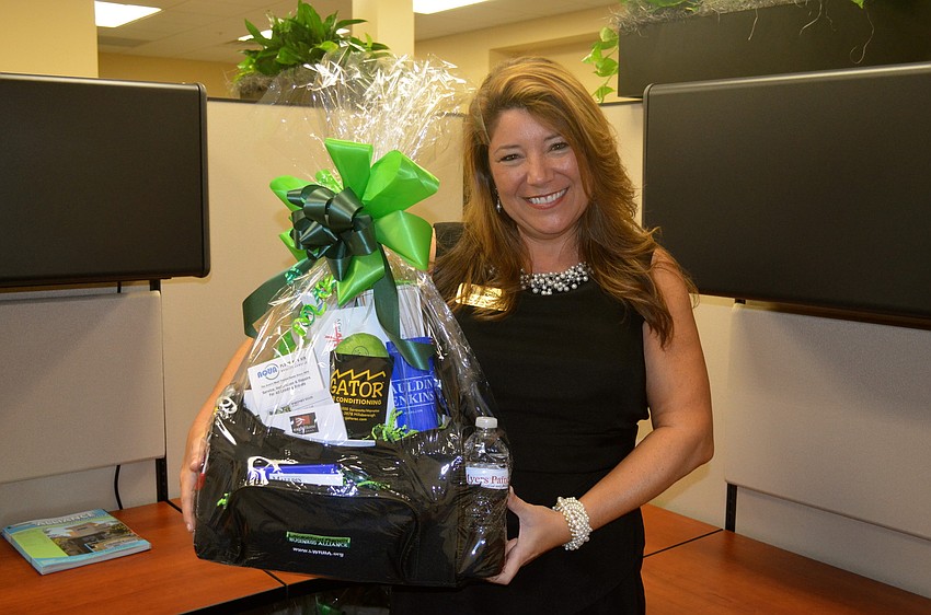 Chairwoman of the Alliance Board Annette Gueli stands in one of the new cubicles.