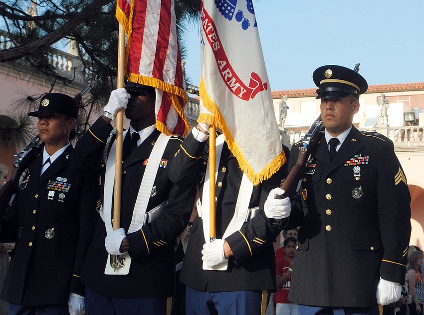 The Color Guard presents the flag.