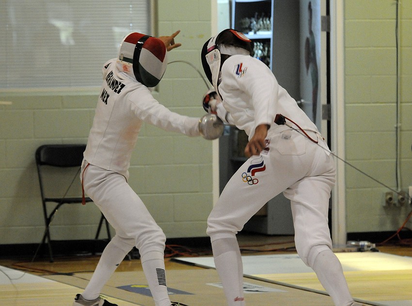 Mexicoâ€™s Ismael Hernandez Uscanga and Russiaâ€™s Aleksander Lesun bout during the mixed relay round robin fencing event.
