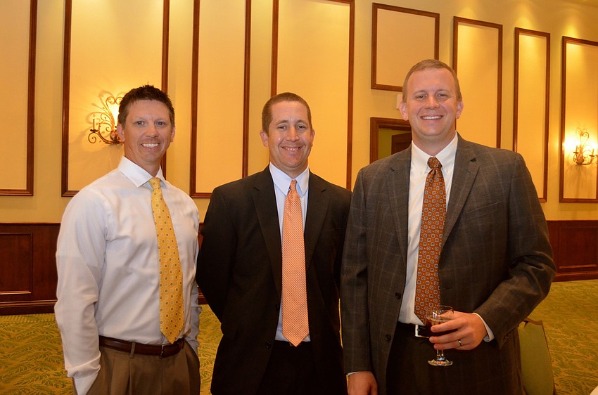 Brett Lacey, Travis Hullinger and Dan Forssell chat before lunch.