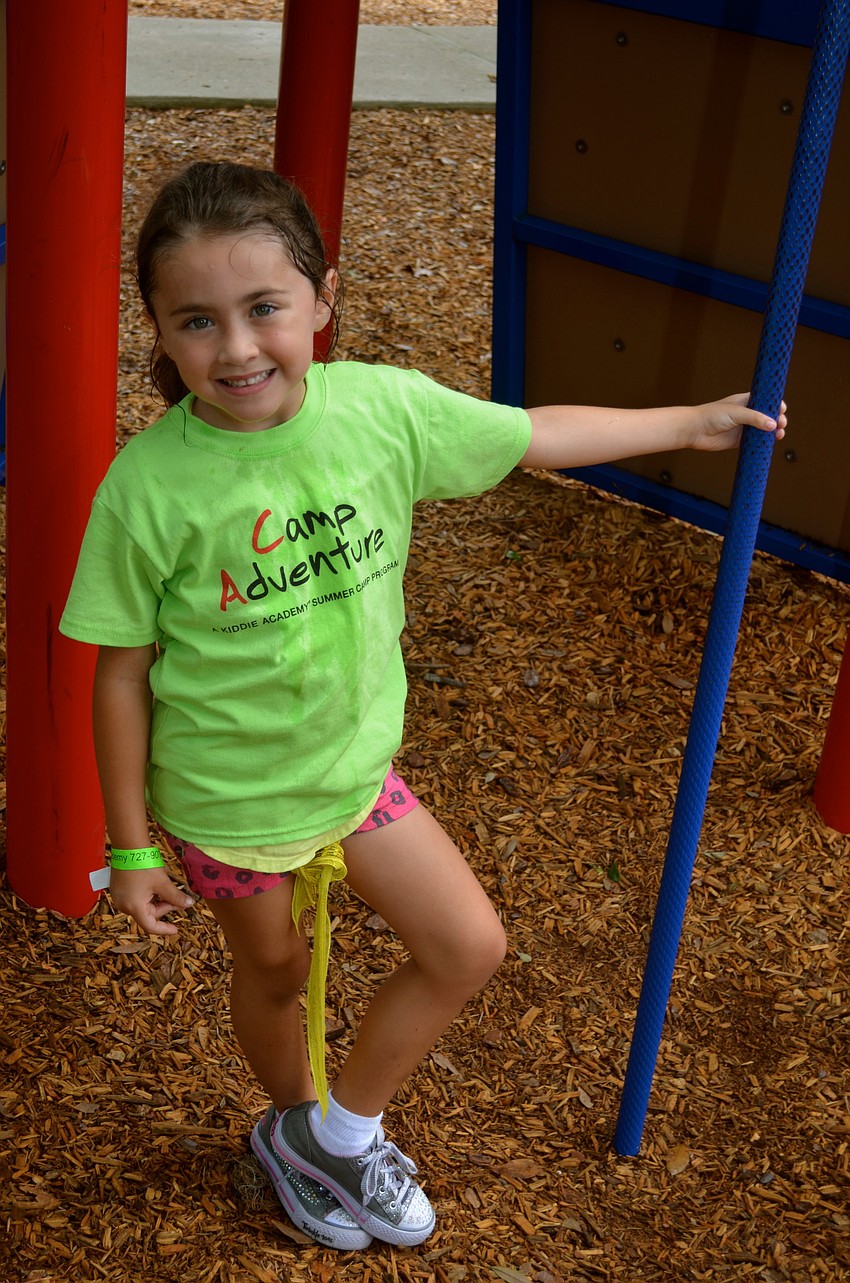 Jaide Brown, 6, takes a break from chasing her friends.